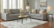 Gray sofa set with decorative pillows in a living room setting.