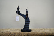 UMA 58372 Black Polystone People Decorative Sculpture with Stairs, 8" x 3" x 14"