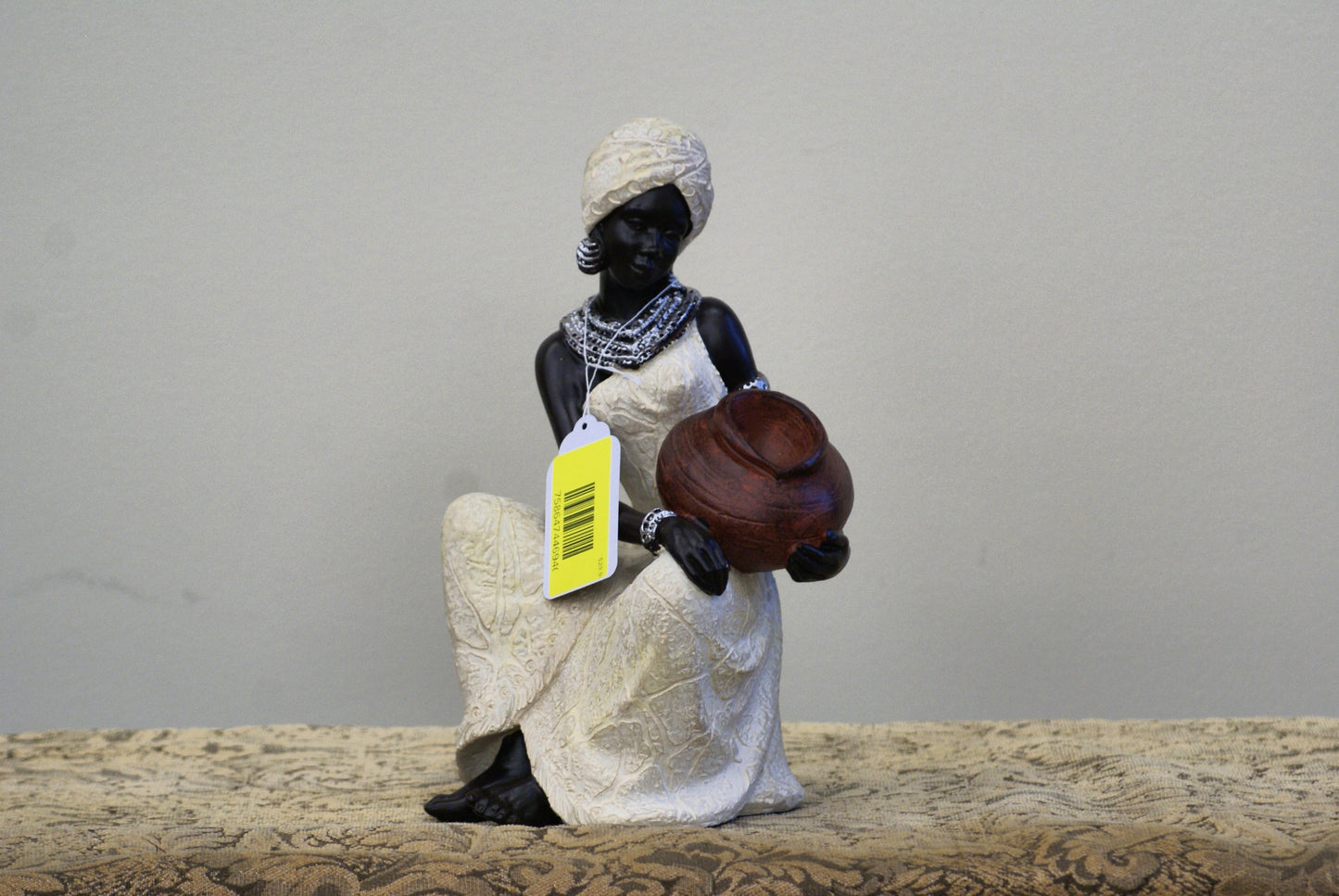 UMA 44694 Cream Polystone Woman Sitting African Decorative Sculpture with Red Water Pot, 6" x 6" x 10"