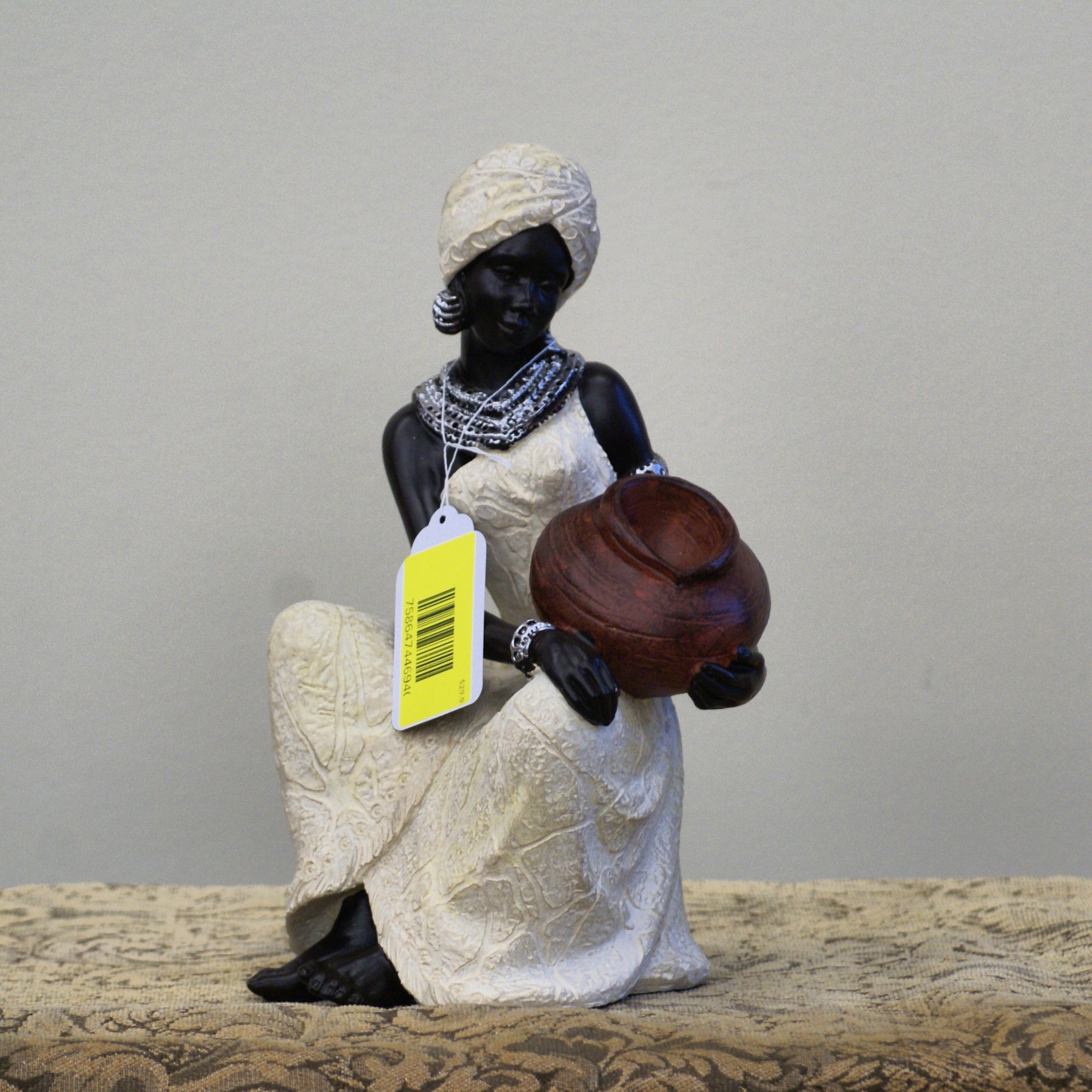 UMA 44694 Cream Polystone Woman Sitting African Decorative Sculpture with Red Water Pot, 6" x 6" x 10"